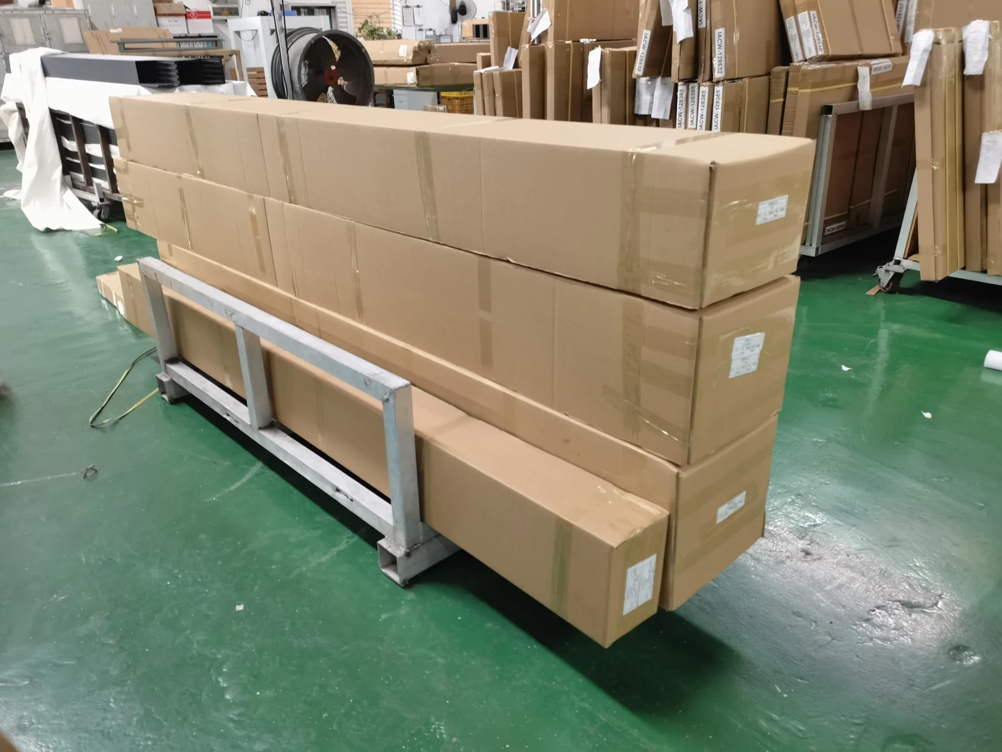 Cartons arranged on a handling trolley; package references help connect receiving with the installation plan.