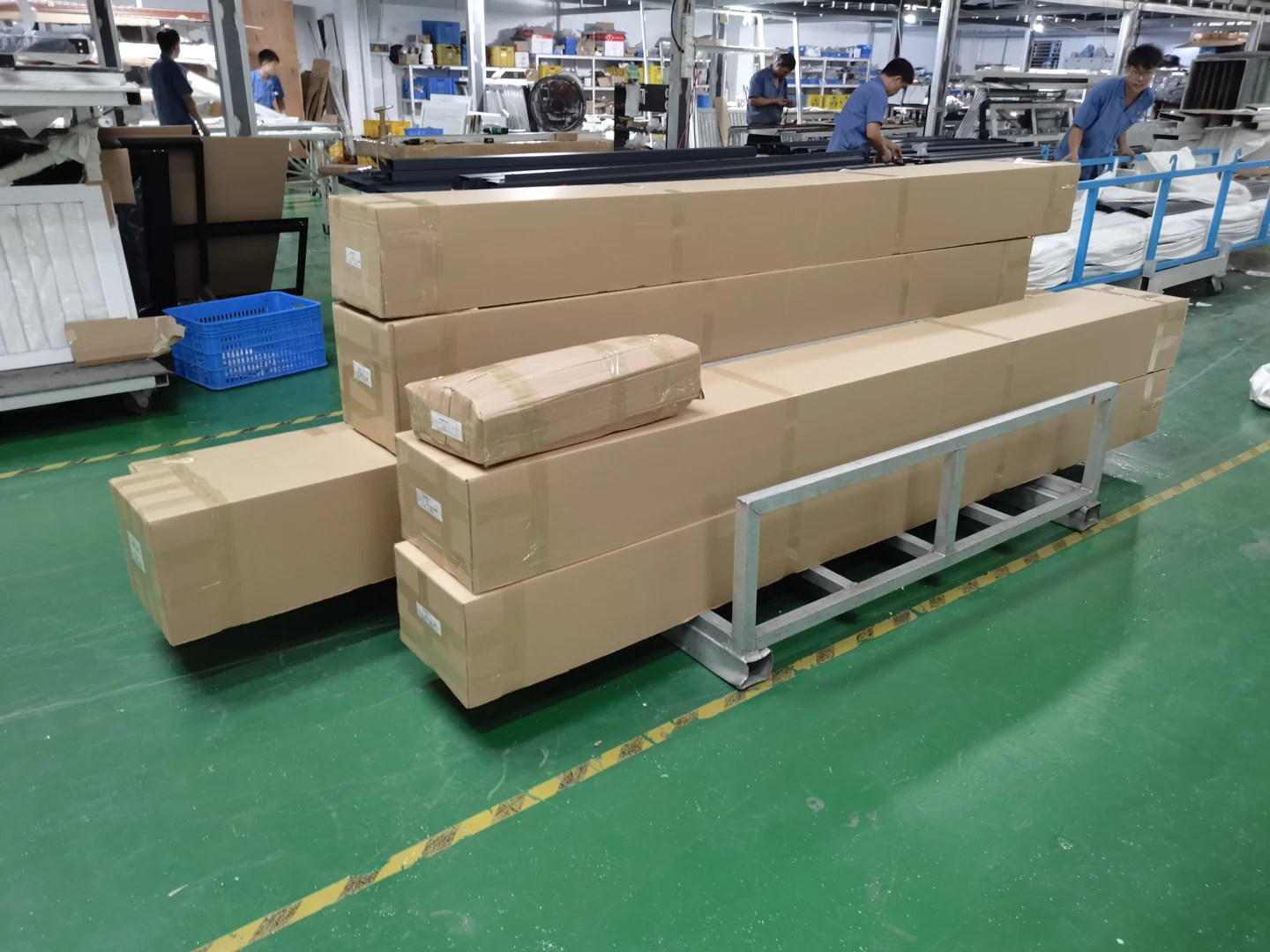 Long product cartons prepared in a workshop; the packing arrangement for each order is agreed separately.
